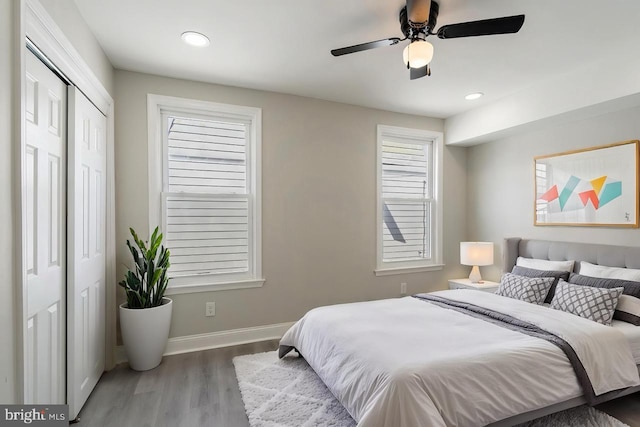 bedroom featuring wood finished floors, baseboards, a ceiling fan, and recessed lighting