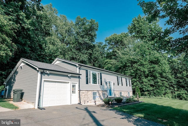 97 Winding Creek Rd, Stafford, VA 22554 - split foyer home with a garage, driveway, a front yard, and stone siding