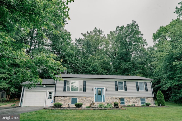 97 Winding Creek Rd, Stafford, VA 22554 - bi-level home featuring an attached garage, driveway, a front yard, and stone siding