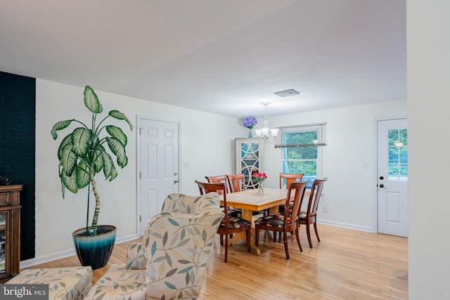 97 Winding Creek Rd, Stafford, VA 22554 - dining area with a chandelier, light wood-type flooring, and baseboards