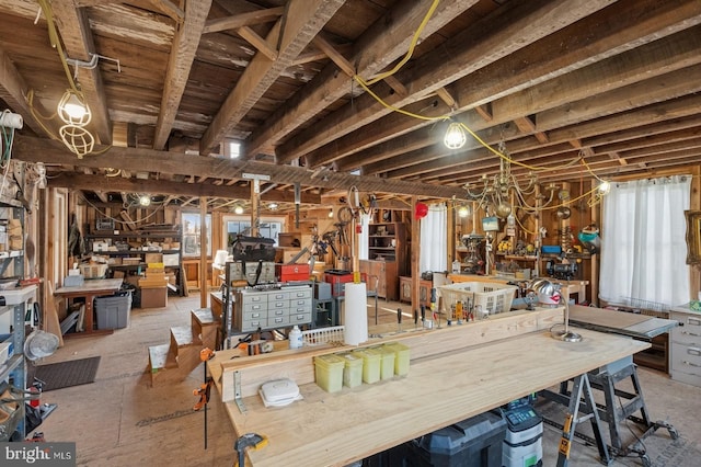 interior space featuring plenty of natural light and a workshop area