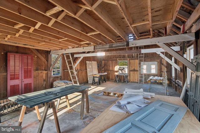 miscellaneous room with wood walls