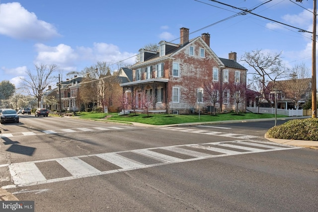 view of road with street lighting, curbs, and sidewalks