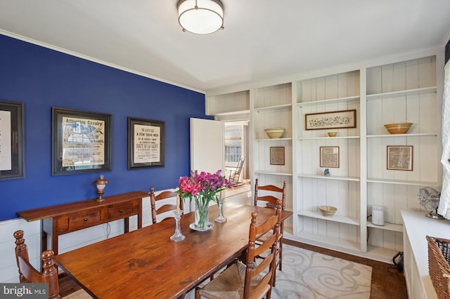dining room featuring crown molding and wood finished floors
