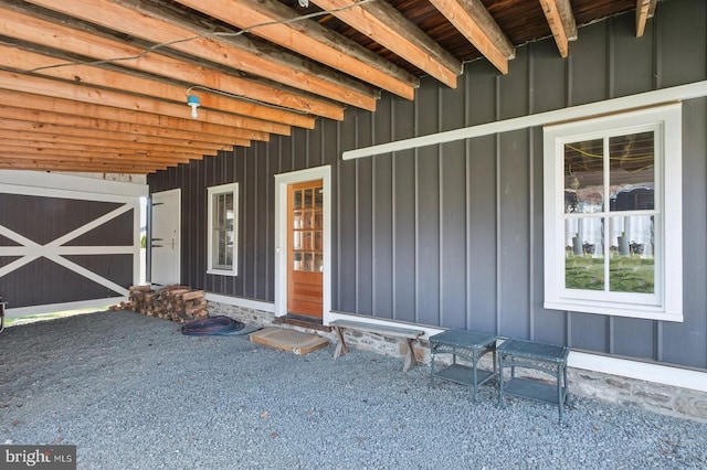 doorway to property featuring board and batten siding