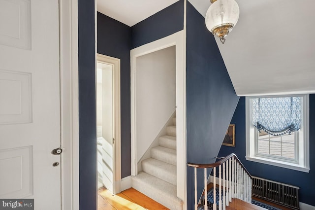 stairs with wood finished floors