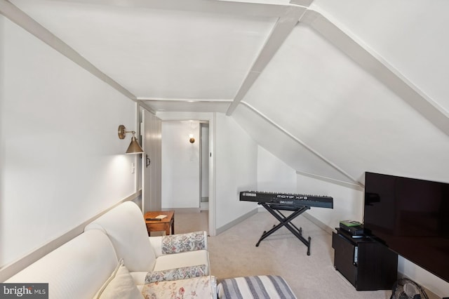 sitting room with baseboards, carpet, and vaulted ceiling