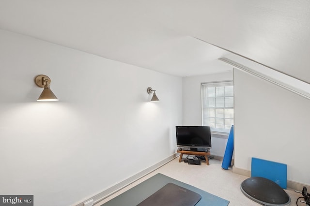 interior space with carpet flooring and baseboards