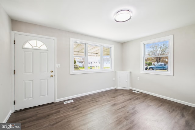 914 Andrews Rd, Glen Burnie, MD 21060 - entrance foyer featuring dark wood-type flooring and baseboards