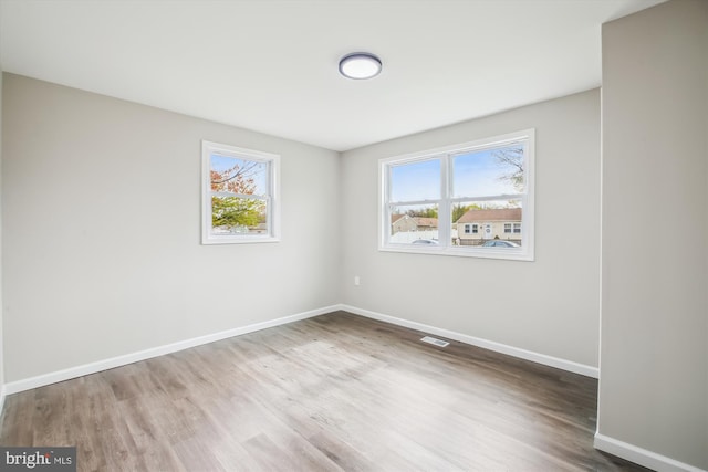 914 Andrews Rd, Glen Burnie, MD 21060 - spare room featuring plenty of natural light, wood finished floors, and baseboards