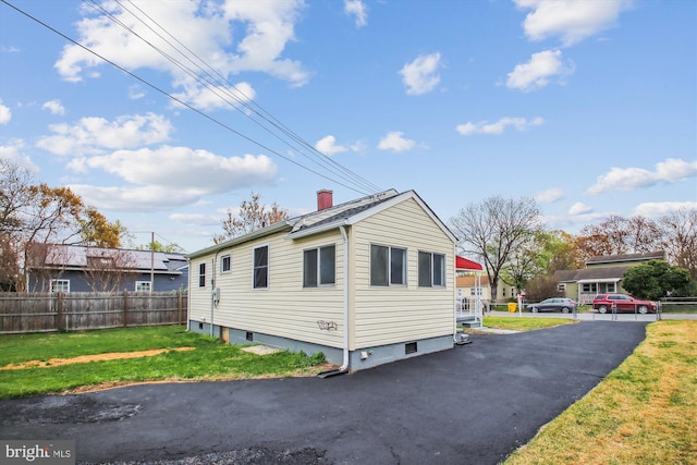 914 Andrews Rd, Glen Burnie, MD 21060 - view of home's exterior featuring a chimney