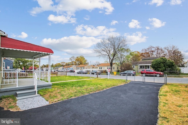 914 Andrews Rd, Glen Burnie, MD 21060 - view of yard featuring a residential view, driveway, and a gate