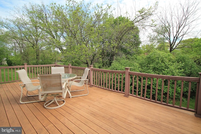 wooden deck featuring outdoor dining space