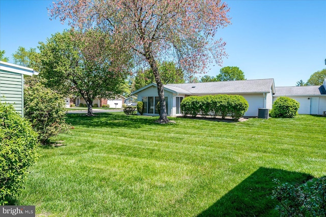 view of yard with central AC