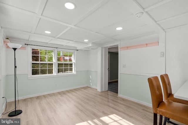 unfurnished office featuring baseboards, wood finished floors, and recessed lighting