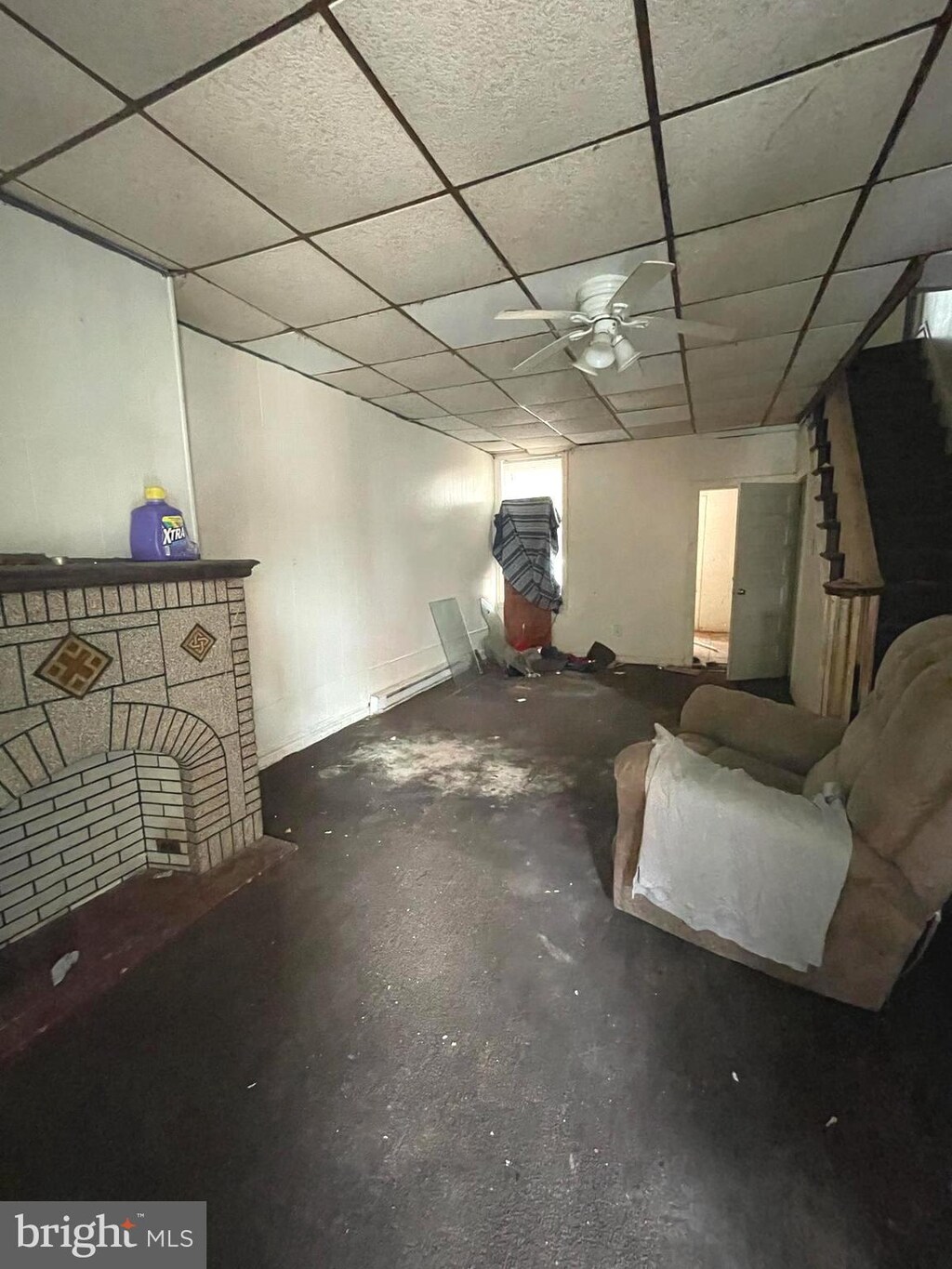 2708 W Seltzer St, Philadelphia, PA 19132 - below grade area with ceiling fan and a paneled ceiling