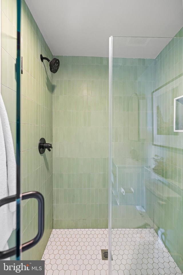 bathroom featuring a stall shower