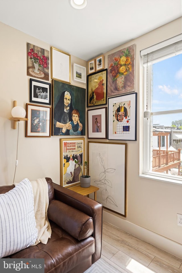 interior space featuring light wood-style floors and baseboards