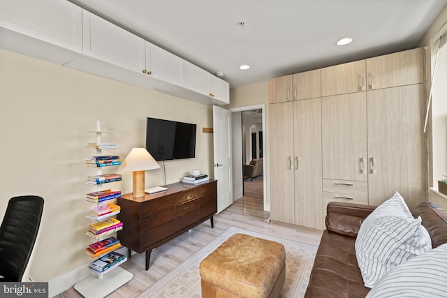 living room featuring recessed lighting and light wood-style flooring