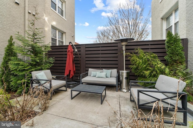 view of patio / terrace with fence and an outdoor living space