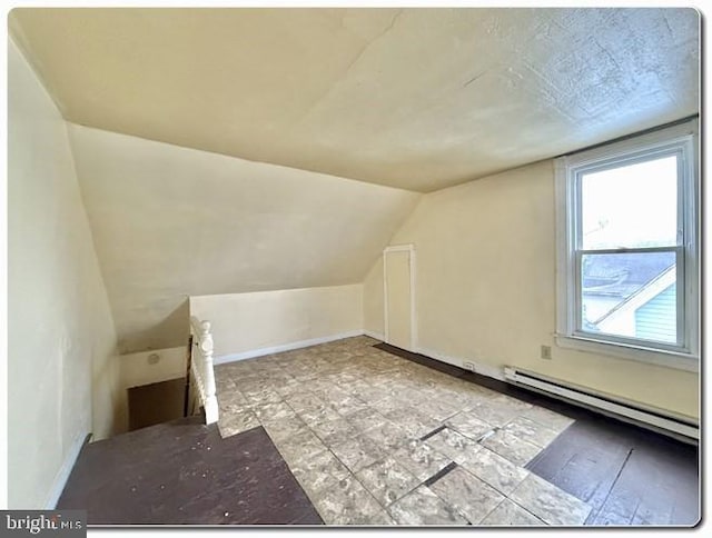 207 S 4th St, Millville, NJ 08332 - bonus room featuring a baseboard heating unit, baseboards, and vaulted ceiling