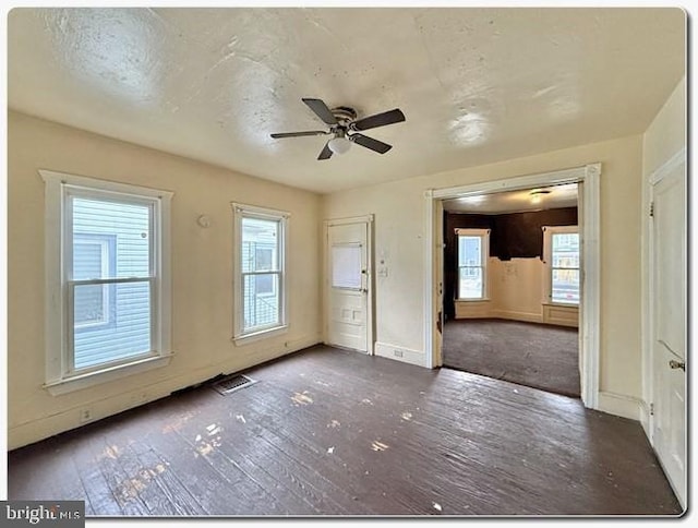 207 S 4th St, Millville, NJ 08332 - unfurnished room featuring hardwood / wood-style floors, baseboards, a ceiling fan, and visible vents