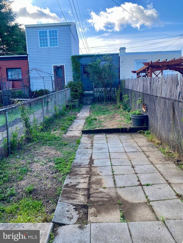 view of yard with a patio and fence private yard
