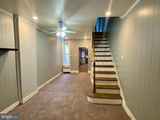 stairway featuring ceiling fan, baseboards, radiator, carpet, and recessed lighting