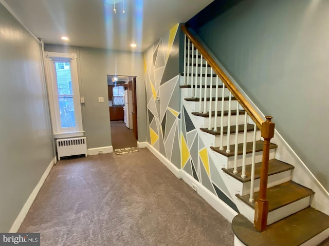 stairway with baseboards, recessed lighting, carpet, and radiator heating unit