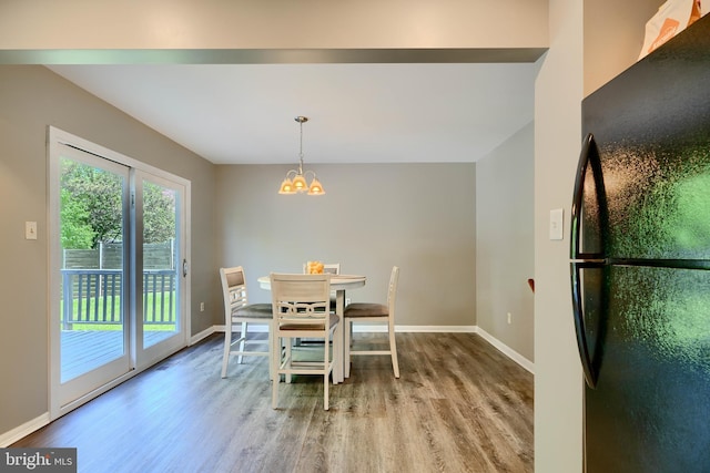 312 Talbot Ct, Abingdon, MD 21009 - dining area with baseboards, wood finished floors, and a notable chandelier
