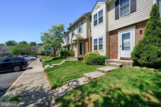 312 Talbot Ct, Abingdon, MD 21009 - view of side of home featuring brick siding, a residential view, and uncovered parking