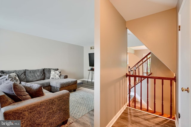 312 Talbot Ct, Abingdon, MD 21009 - living area with stairway, baseboards, and wood finished floors