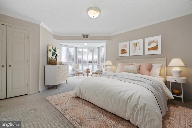 carpeted bedroom with crown molding, a textured ceiling, and baseboards