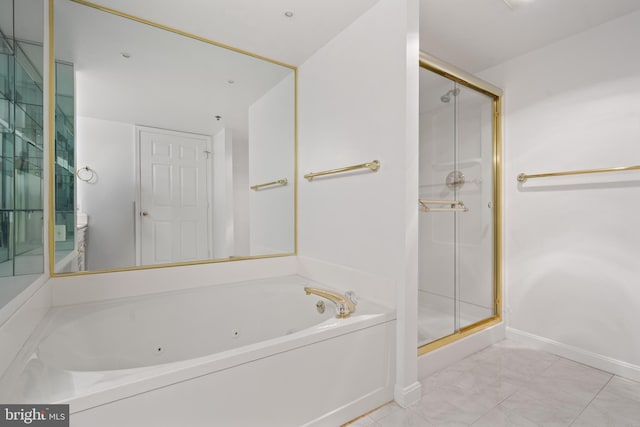 full bath featuring a stall shower, a tub with jets, baseboards, and marble look tile flooring