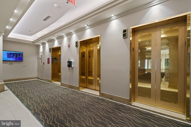 common area with ornamental molding and recessed lighting