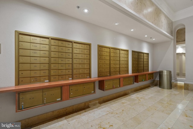 view of community featuring mail area, recessed lighting, and ornamental molding