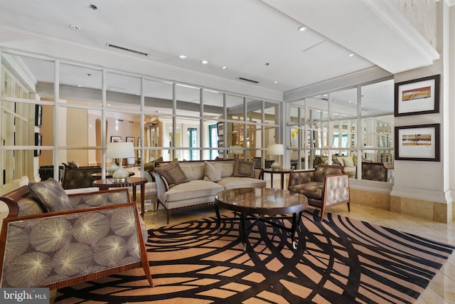lobby with ornamental molding and recessed lighting