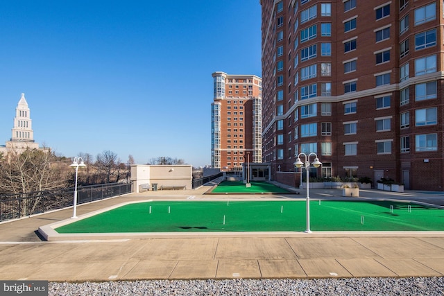 view of pool featuring a putting green