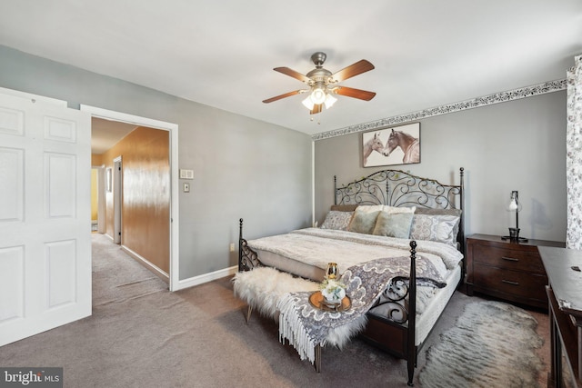 bedroom with ceiling fan, carpet flooring, and baseboards