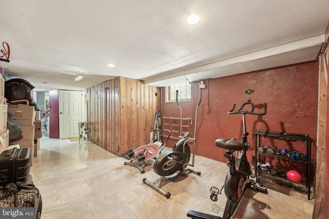 workout area with wooden walls