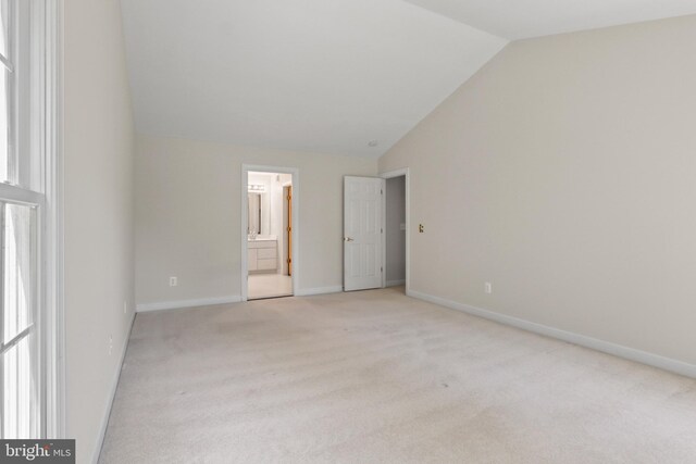 20461 Mcgees Ferry Way, Sterling, VA 20165 - unfurnished bedroom with vaulted ceiling, carpet, connected bathroom, and baseboards
