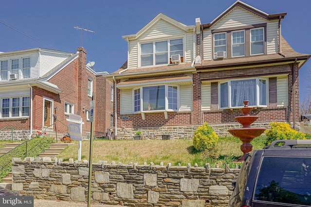 view of front of home with brick siding and cooling unit