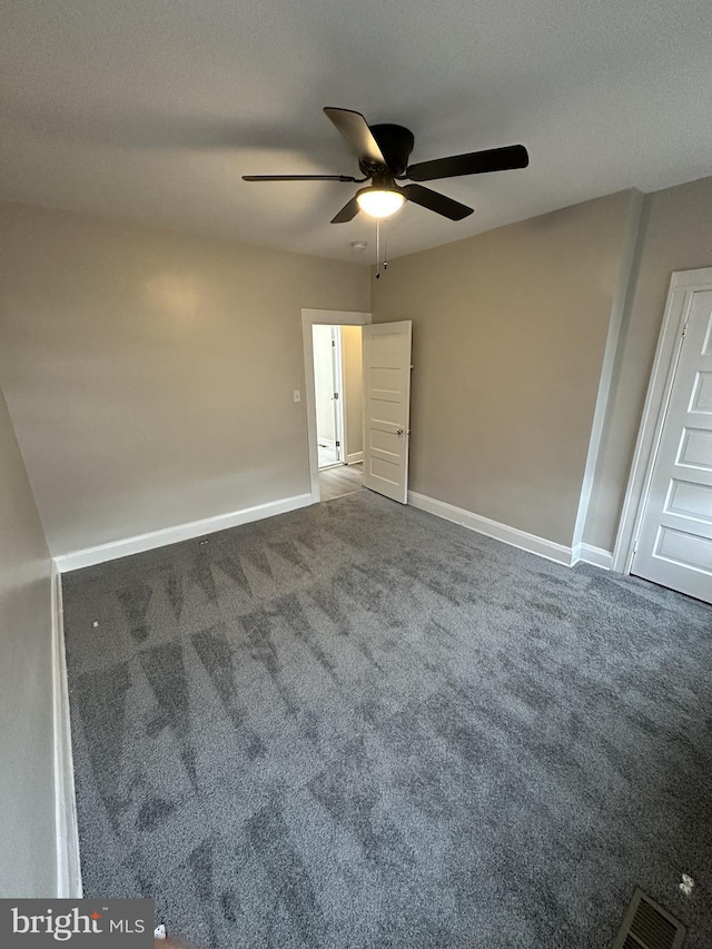 unfurnished bedroom with visible vents, carpet flooring, baseboards, and ceiling fan