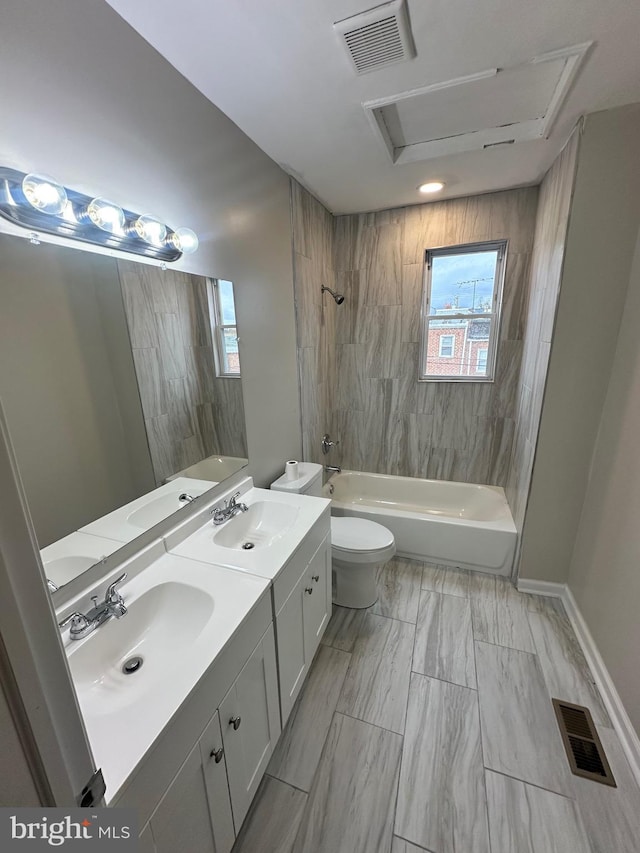 bathroom with a sink, shower / bathtub combination, and visible vents