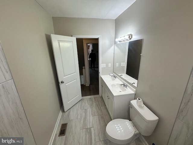 bathroom featuring visible vents, marble finish floor, toilet, and vanity