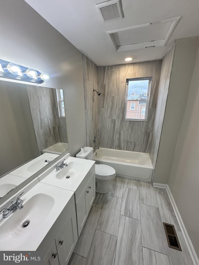 bathroom with visible vents, a sink, and toilet