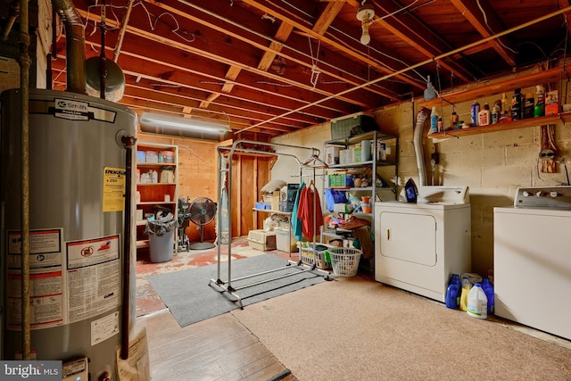 unfinished basement with independent washer and dryer and gas water heater
