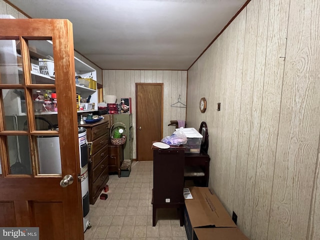 office space with light floors and wood walls