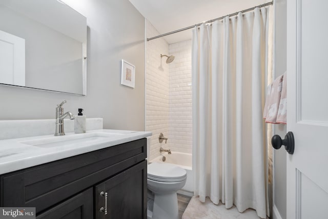 bathroom with vanity, toilet, and shower / tub combo with curtain
