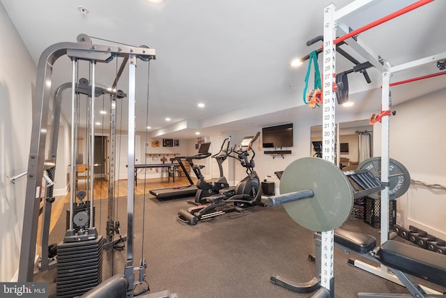 gym featuring baseboards and recessed lighting